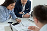 three people in a meeting