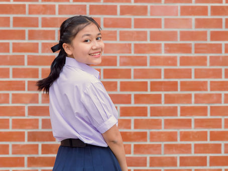 Teenager looks at camera