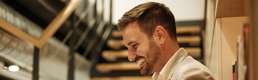 Person smiling at laptop