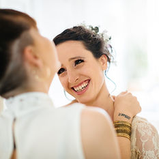 Laughing women embracing