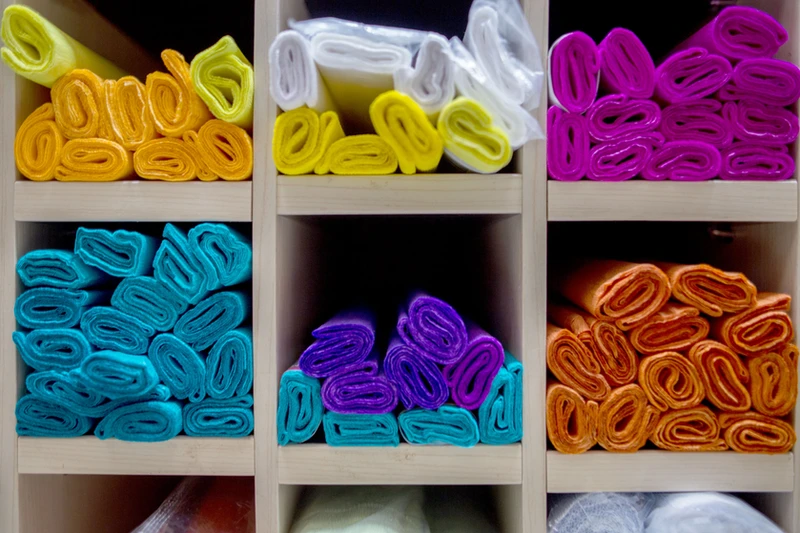 a close up of a green fern leaf with a dark background