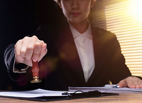 image of notary applying stamp