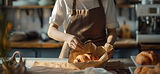 Baker Wrapping a Fresh Croissant