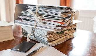 A pile of reports and a phone