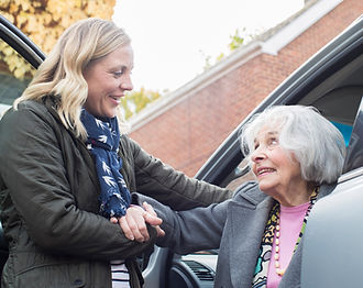assisting an elderly getting out of the car