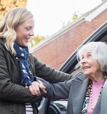 Helping an elderly woman.