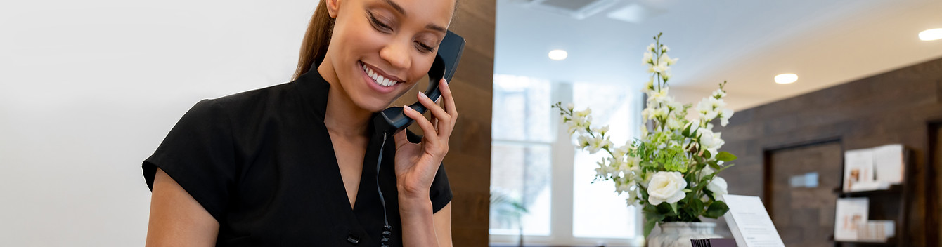 Receptionist Using Tablet