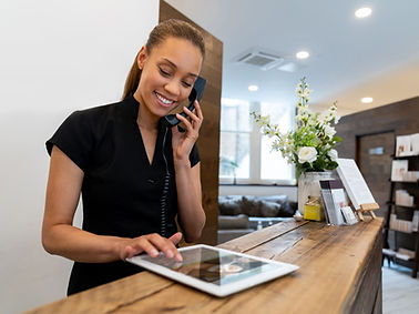 Receptionist Using Tablet