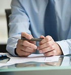 close-up image of a person's hand with pen