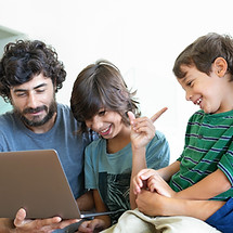 Family Using Laptop
