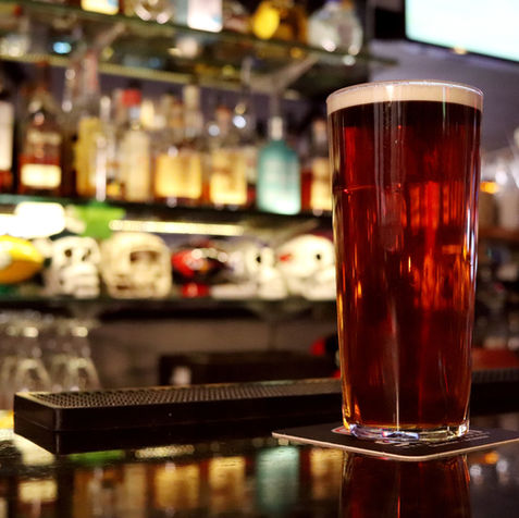 Pint of beer on a bar counter