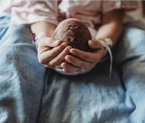 Newborn Held Gently