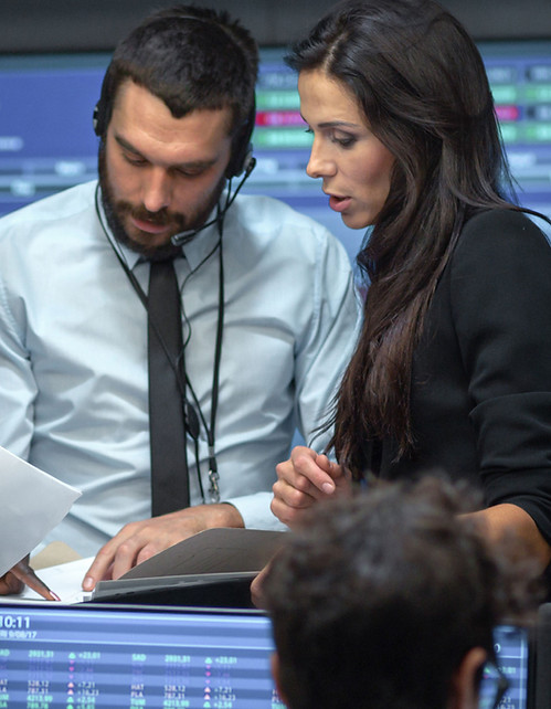 A team discussion at a trading room