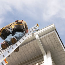 Repairing gutter on ladder