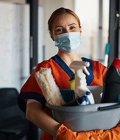 Person holding cleaning supplies