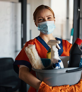 Person holding cleaning supplies