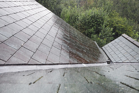 Rain hitting a slate roof