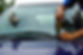 Technician using tool to repair front car windscreen