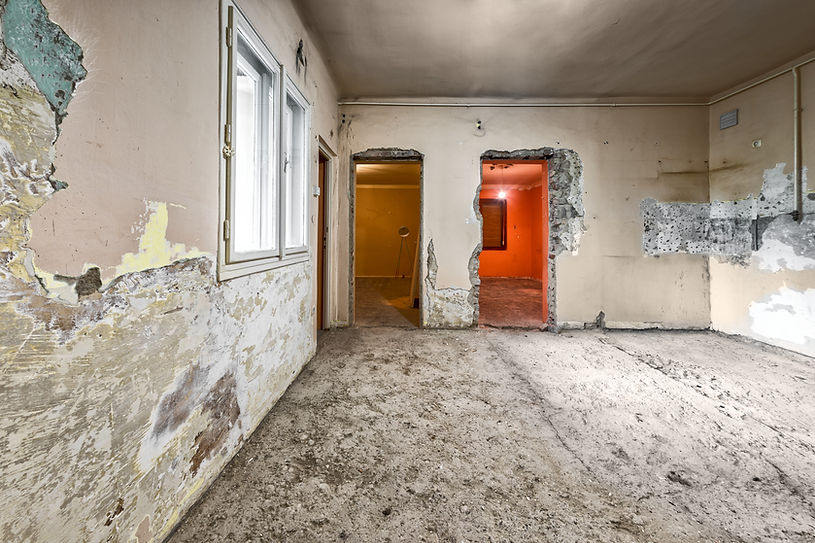 A large damaged room in an old building