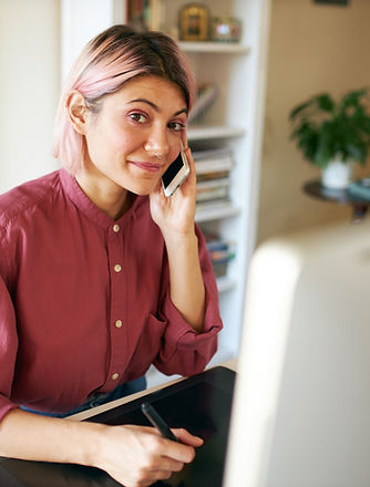 A receptionist at her desk waiting for a call