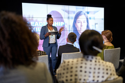 CEO educating employees during corporate event