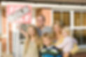 Family outside new house