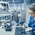Woman Fixing Electronics