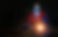 A skilled welder in protective gear creates bright sparks while working