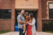 Family in front of school