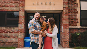 Expat family in front of a Hong Kong international primary school