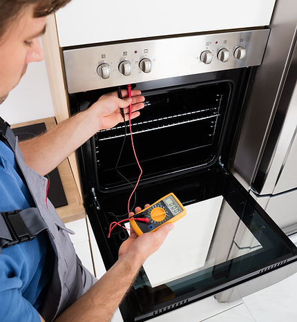 View of a person inspecting the oven