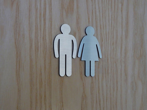 Image of modern public toilet sign, men / women, gents / ladies