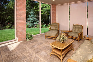 Sunroom with furniture and outdoor view