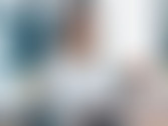 A happy woman working on a laptop