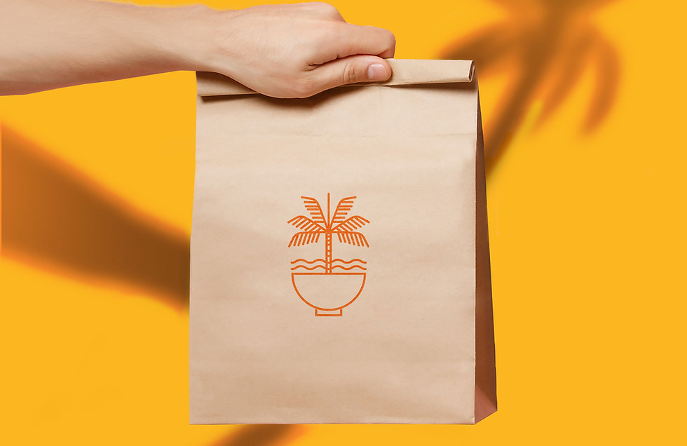 Hand Holding Brown Paper Bag