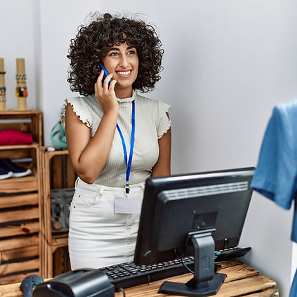 Retail worker smiling on the phone