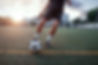 Playing soccer at sunset