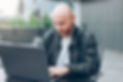 Image of a man looking at a computer, representing online counseling. Access online counseling services in Illinois, Texas, Florida, Indiana, and more with our experienced therapists