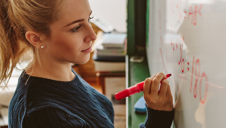 Students Writing on Board