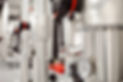 Insulated pipes, flow valves, and a thermometer gauge in a plant room