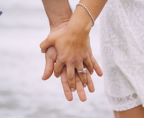 Engaged Couple Holding Hands