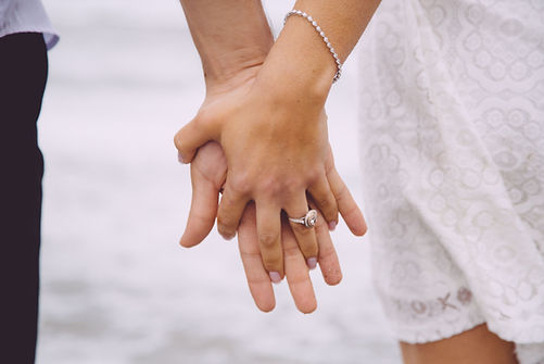 Engaged Couple Holding Hands
