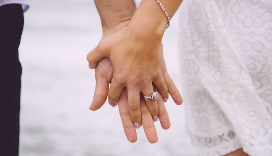 Engaged Couple Holding Hands