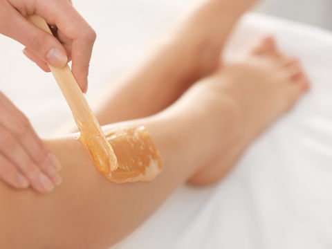 A leg with wax on the skin ready for hair removal.