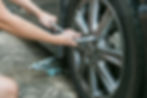 Mechanic hands changing with tool repairing the tire