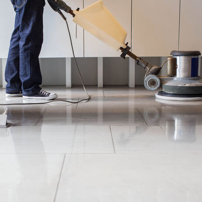 Cleaner using a machine to clean the floor