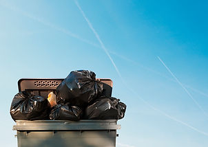 black garbage bags and blue sky