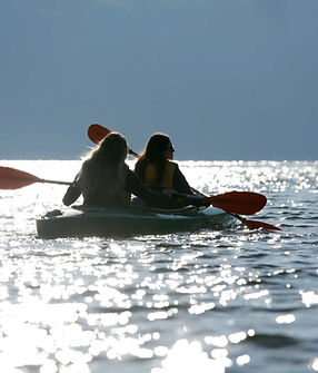 People kayaking on water