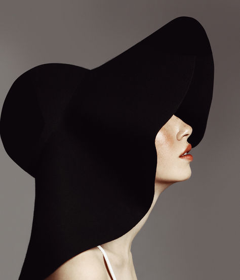 Elegant woman with black, large hat