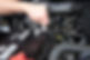 A professional repairing a car battery